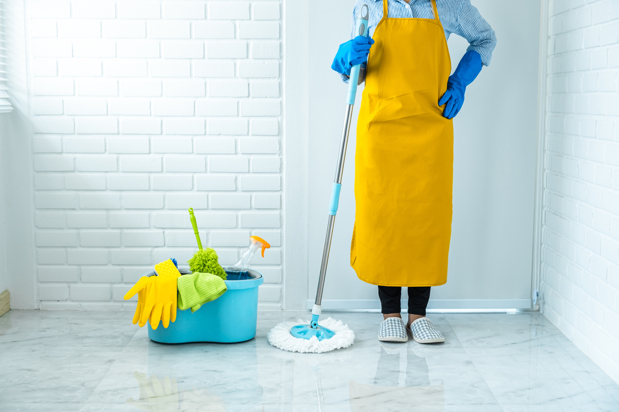 Housekeeper Cleaning the Floor