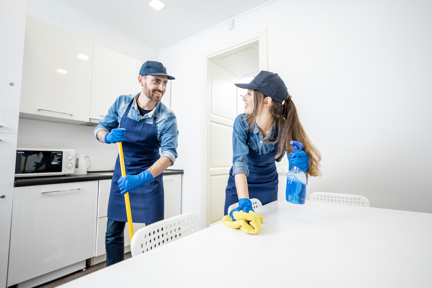 Housekeepers Cleaning the Apartment